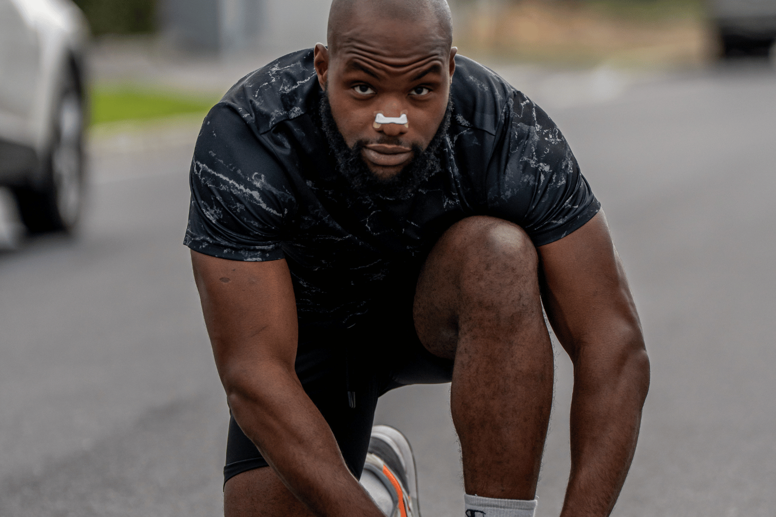 athlete wearing magnetic nose strips about to start running